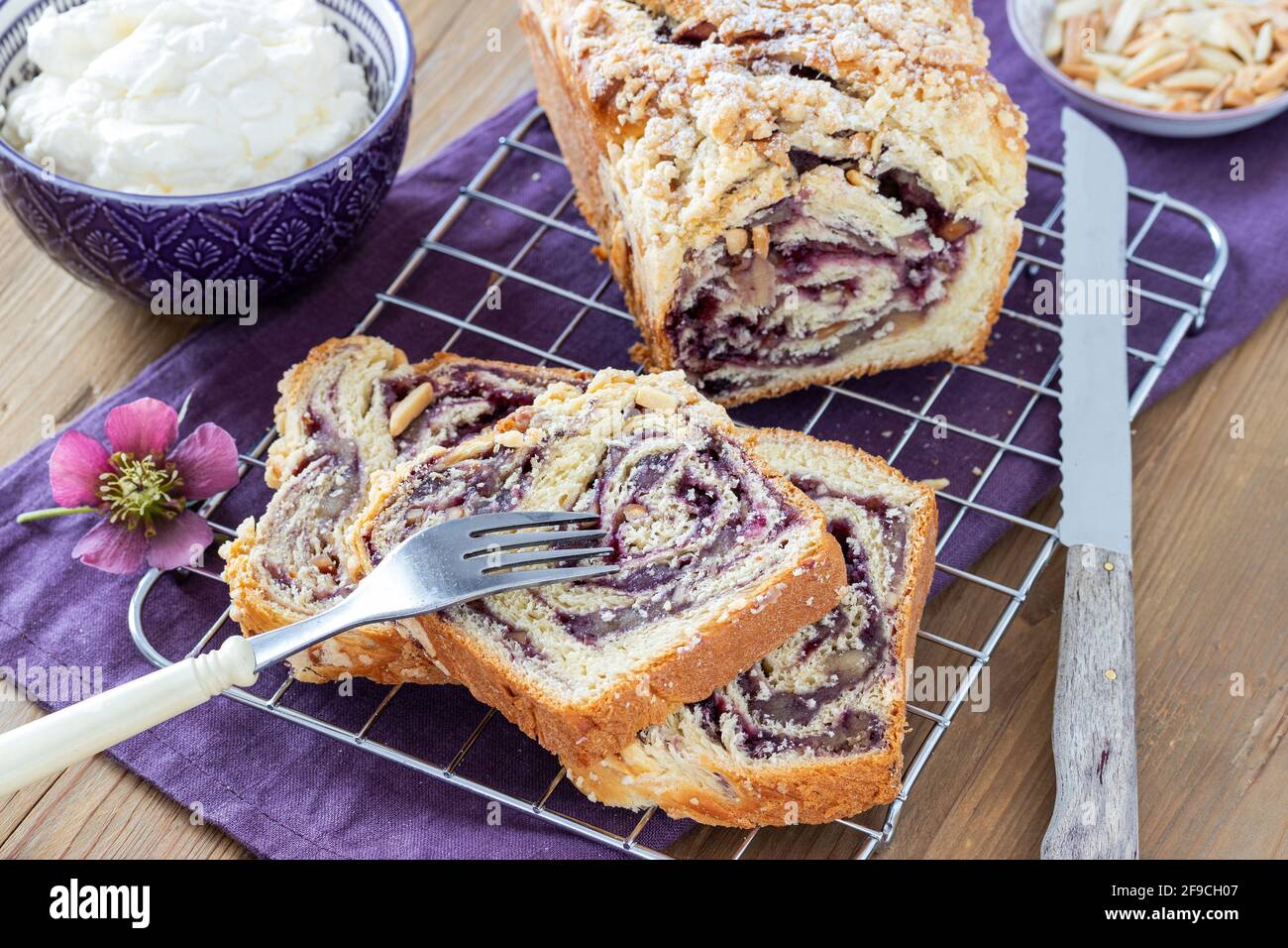 yeast cake with blueberry jam on cake grid Stock Photo