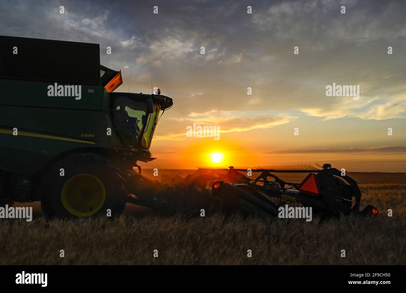 Fall harvest on the Canadian prairies in the Saskatchewan grain belt. Stock Photo