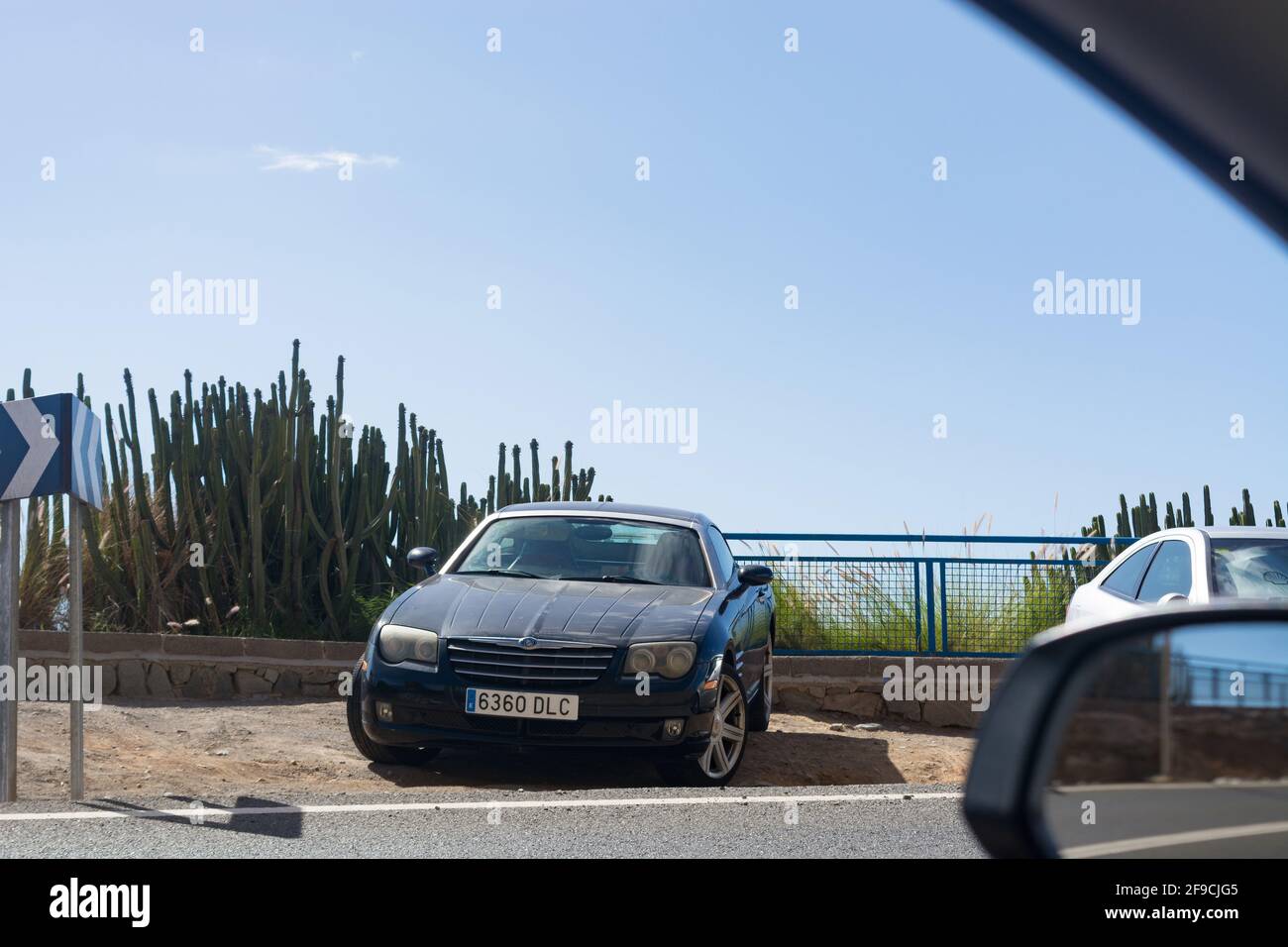 CRAN CANARIA, PUERTO RICO - NOVEMBER 16, 2019: Chrysler Crossfire Coupe in a parking lot above the marina in Puerto Rico on Gran Canaria. Stock Photo