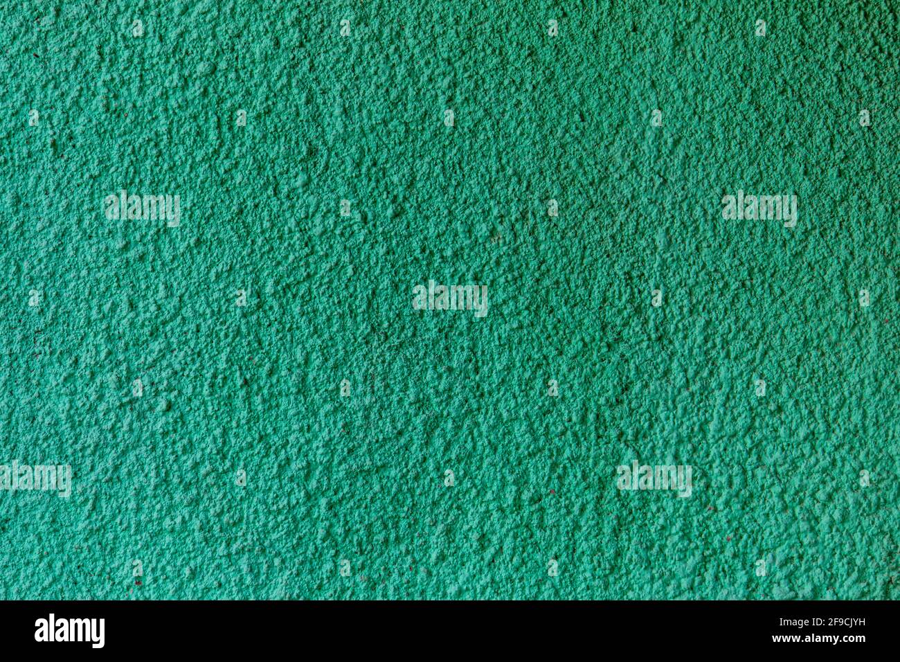 Green Painted Plastered Cement Wall Stock Photo