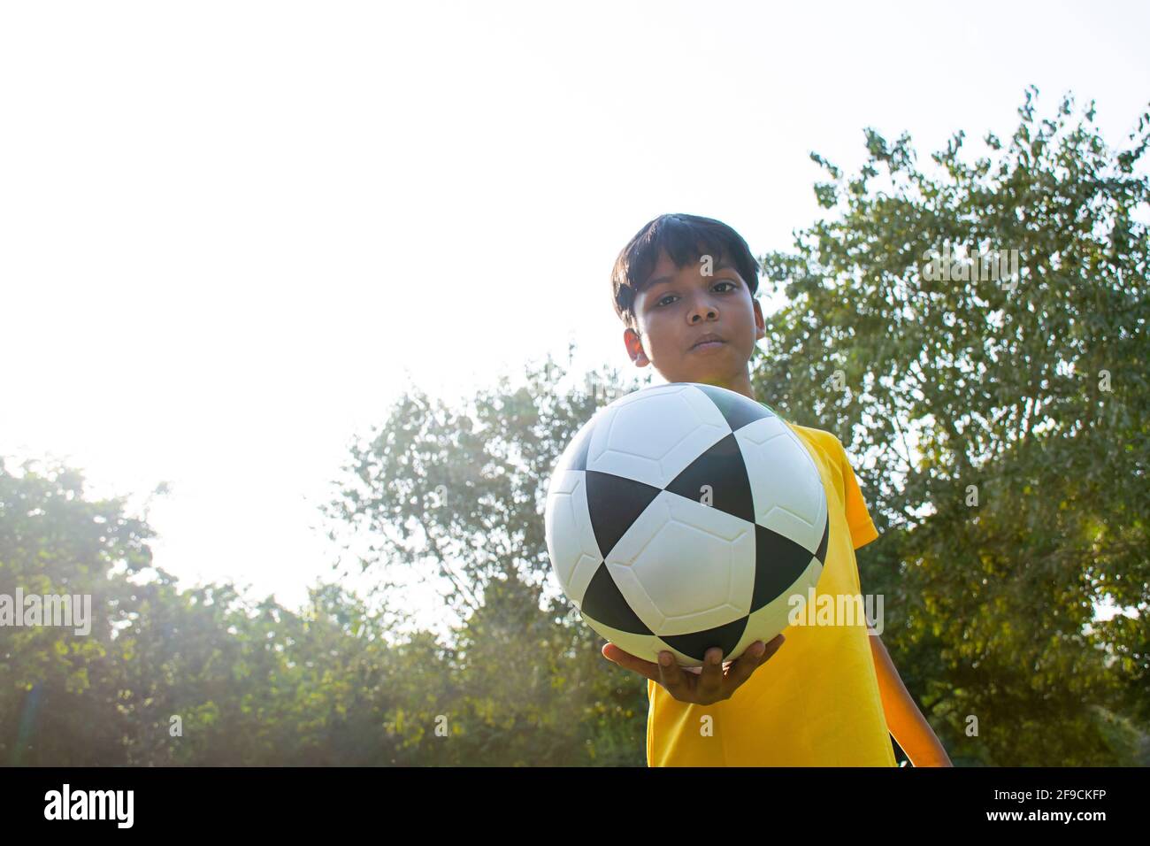 Young Boy Holding Soccer Ball Stock Photo Alamy