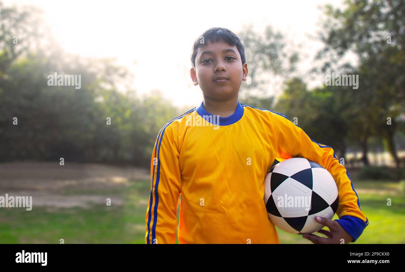 Young Boy Holding Soccer Ball Stock Photo Alamy