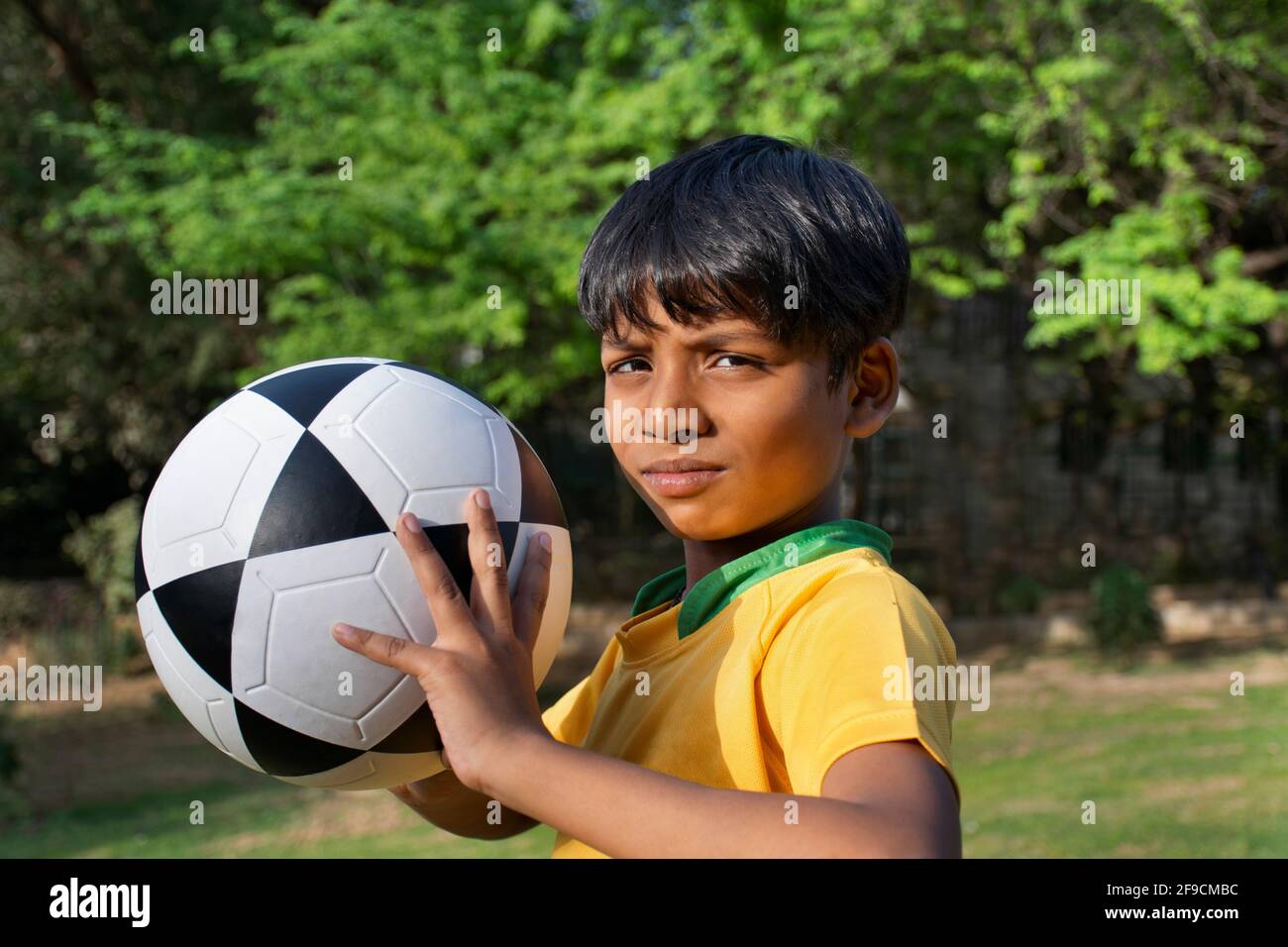 Young Boy Holding Soccer Ball Stock Photo Alamy