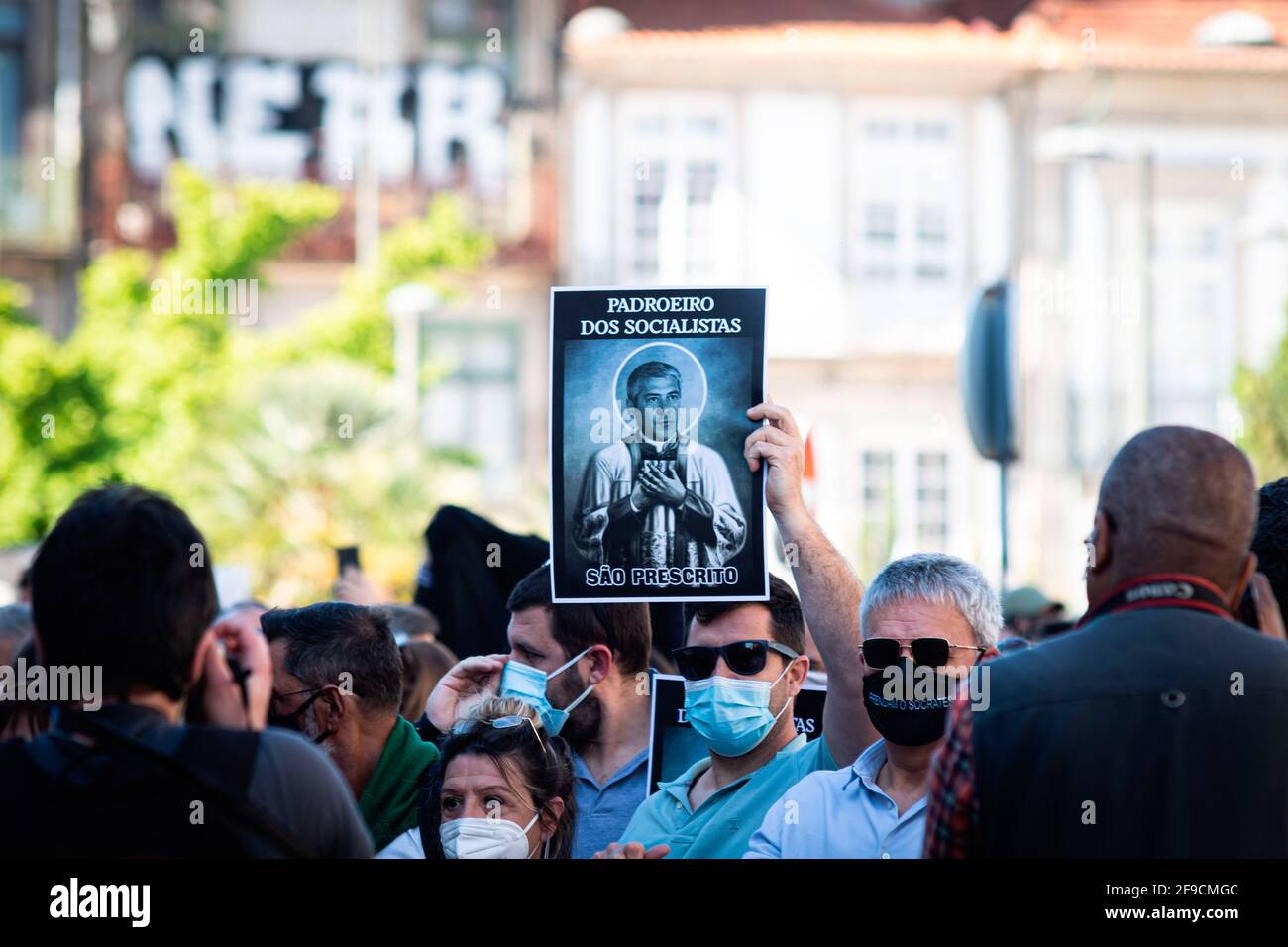 Porto, Portugal. 17th Apr, 2021. A protesters holds a placard with a portrait of José Sócrates portrayed as a saint during the demonstration. Protest against corruption in the Downtown of Porto organized because the Portuguese ex-Prime Minister José Sócrates was pardoned of most of the crimes he was charged for. (Photo by Teresa Nunes/SOPA Images/Sipa USA) Credit: Sipa USA/Alamy Live News Stock Photo
