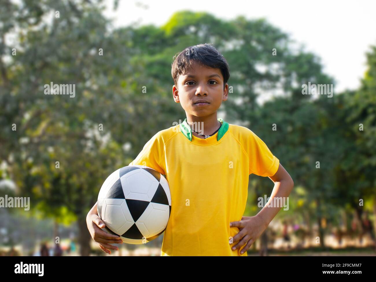 Young Boy Holding Soccer Ball Stock Photo Alamy