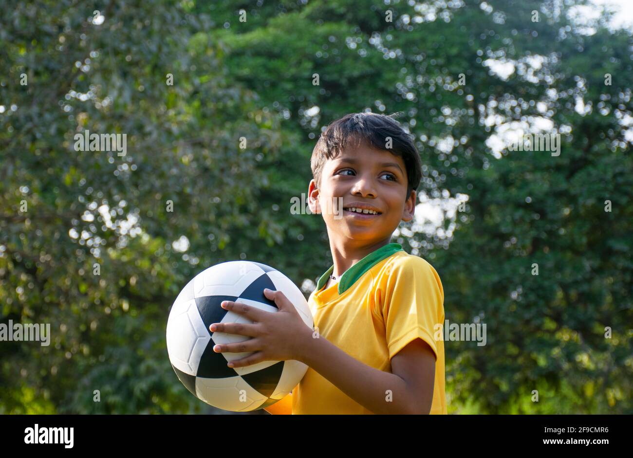 Young Boy Holding Soccer Ball Stock Photo Alamy