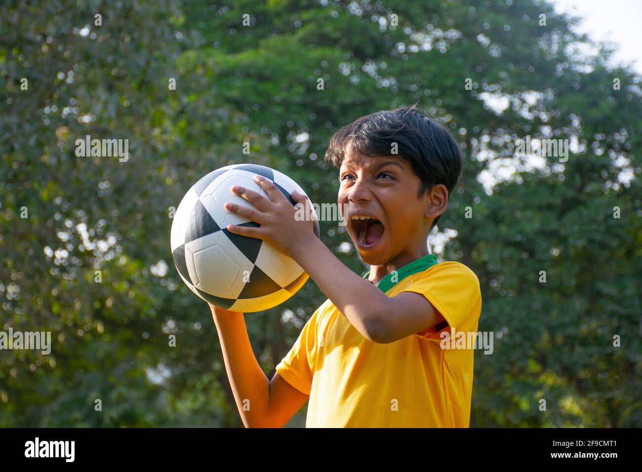 Soccer player shouting on the park Stock Photo