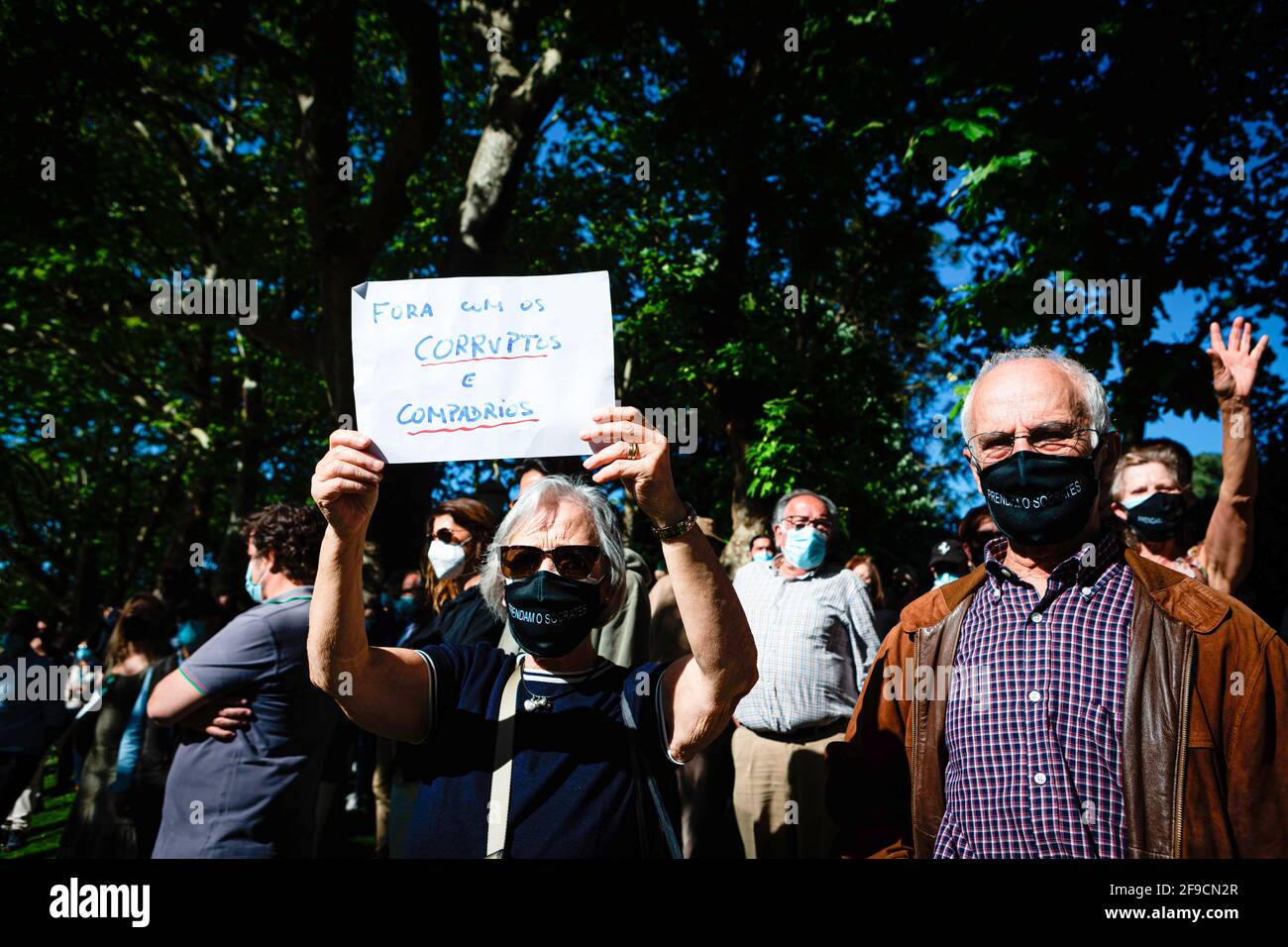 Porto, Portugal. 17th Apr, 2021. An elderly couple takes part during the demonstration. Protest against corruption in the Downtown of Porto organized because the Portuguese ex-Prime Minister José Sócrates was pardoned of most of the crimes he was charged for. Credit: SOPA Images Limited/Alamy Live News Stock Photo