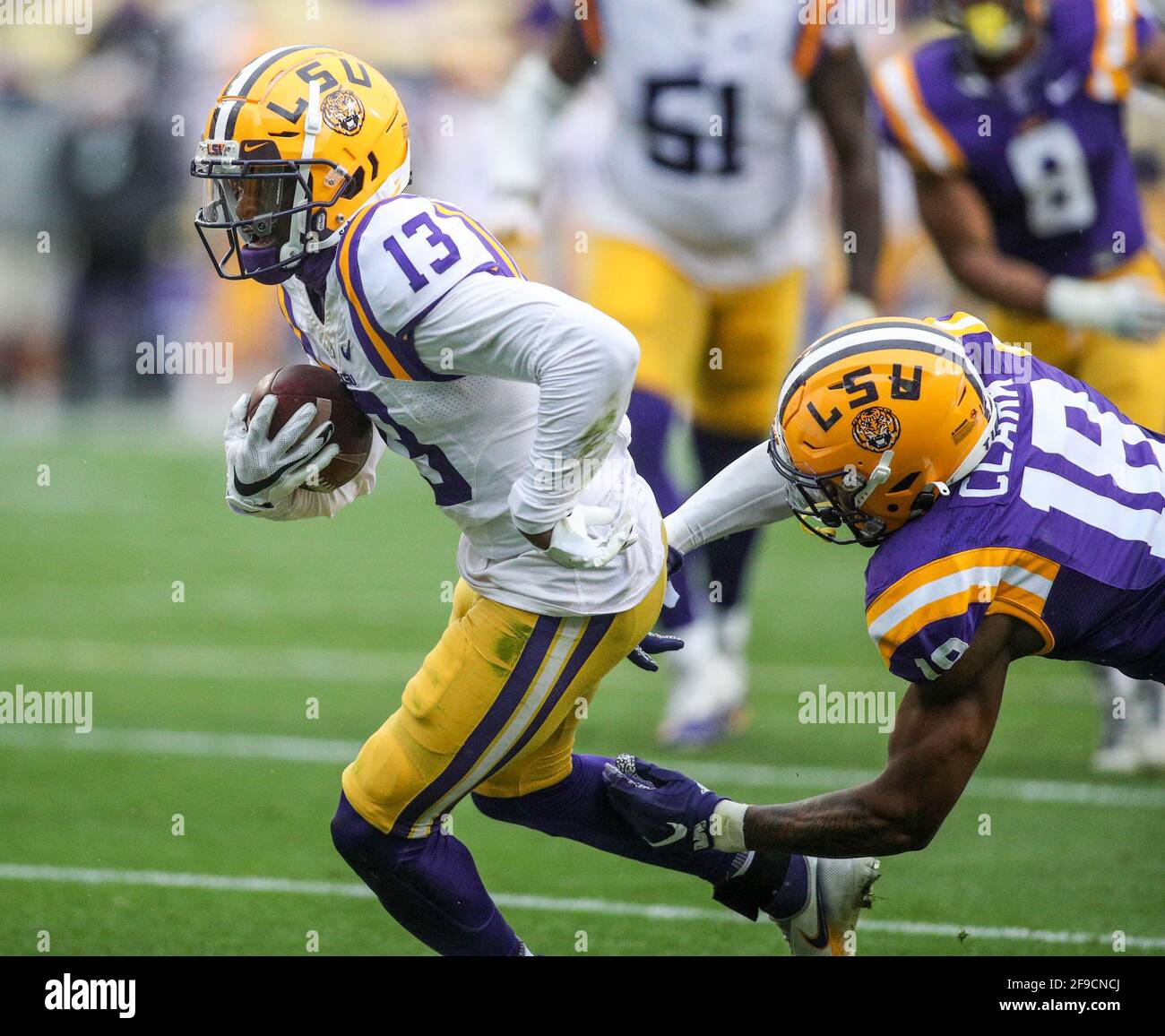 Baton Rouge, LA, USA. 17th Apr, 2021. LSU receiver Kontre Kirklin (13) looks for the endzone as linebacker Damone Clark (18) tries to stop him during the National L Club LSU Spring Game at Tiger Stadium in Baton Rouge, LA. Jonathan Mailhes/CSM/Alamy Live News Stock Photo