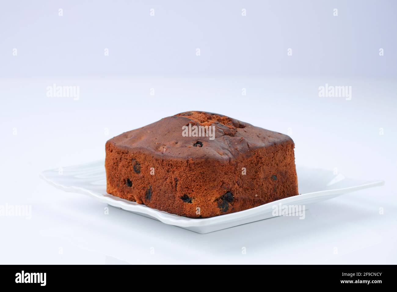 Plum cake, home made delicious christmus cake using raisins ,cashew nuts  and dried fruits placed on a white table ware with white colour background,  i Stock Photo - Alamy