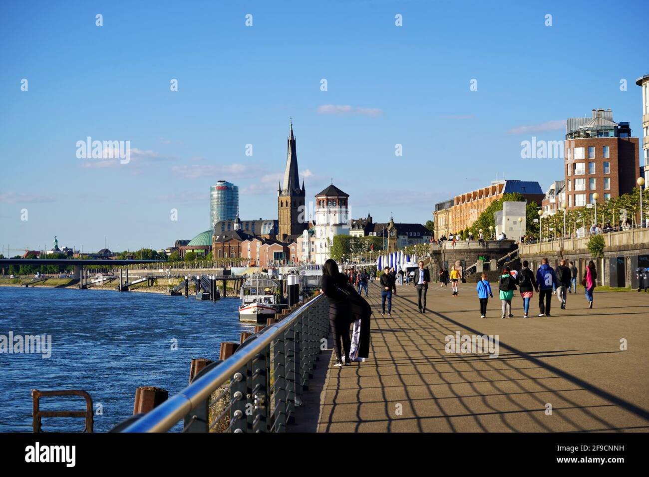 The popular Rhine promenade in Düsseldorf on a sunny day. Stock Photo