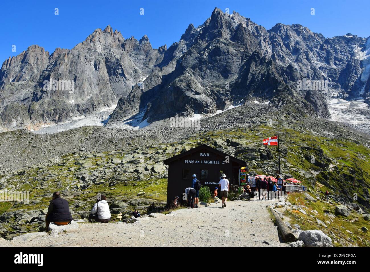 Chamonix, France - August 23, 2019. Chalet at Plan de l'Aiguille and Aiguille du Midi summit, Chamonix, Mont Blanc, Haute-Savoie, France Stock Photo