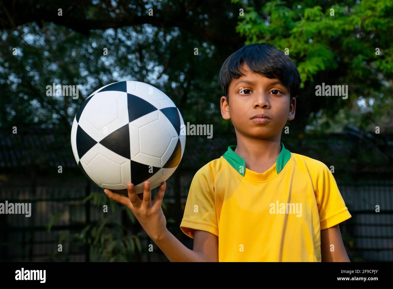 Young Boy Holding Soccer Ball Stock Photo Alamy