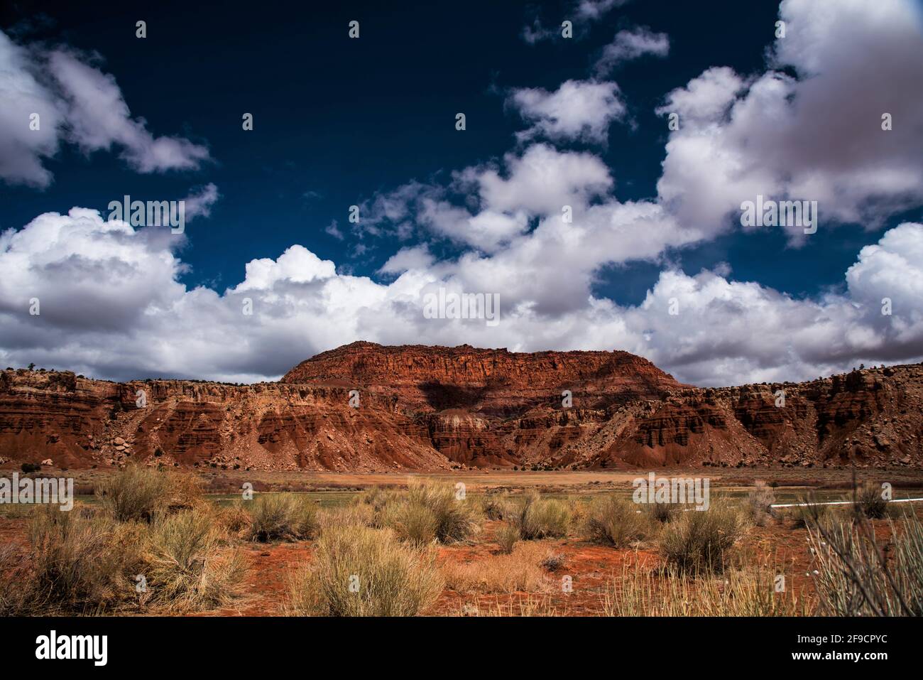 Red rock mesas, cobalt blue sky and white puffy clouds in southeast