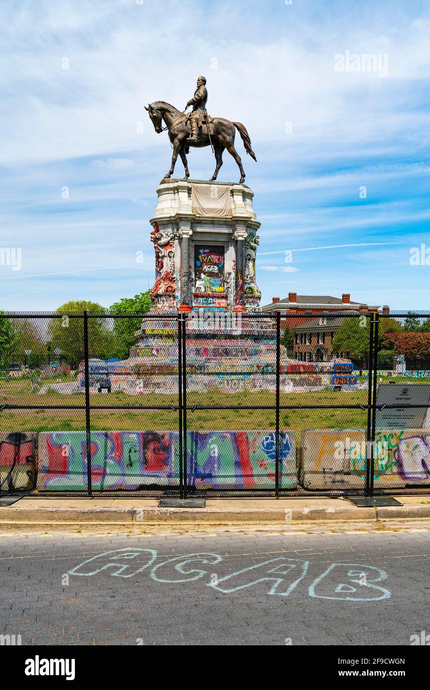 The Lee Monument in Richmond, Virginia with graffiti after protests of the killing of George Floyd and calls for its removal. ACAB graffiti on street. Stock Photo