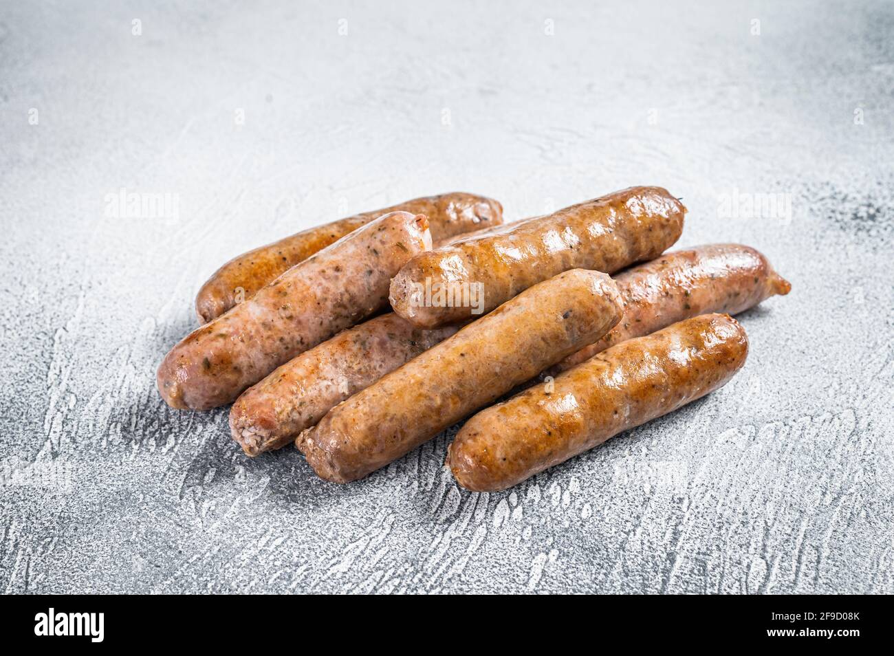 Roasted Bratwurst Hot Dog sausages. White background. Top View Stock Photo