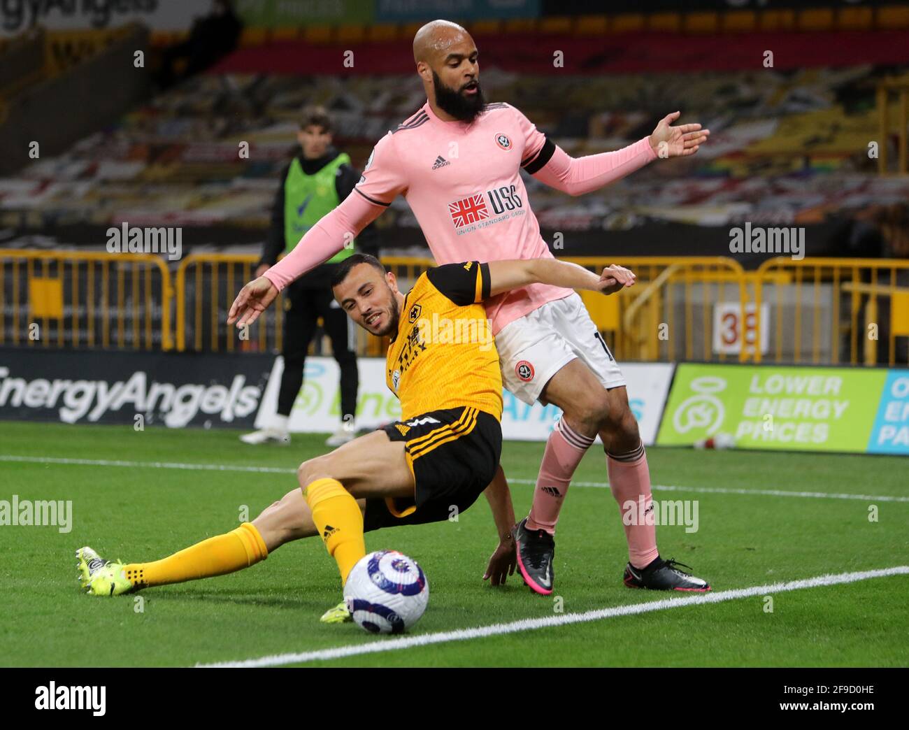 Wolverhampton Wanderers' Daniel Podence (left) and Sheffield United's David McGoldrick battle for the ball during the Premier League match at Molineux, Wolverhampton. Picture date: Saturday April 17, 2021. Stock Photo