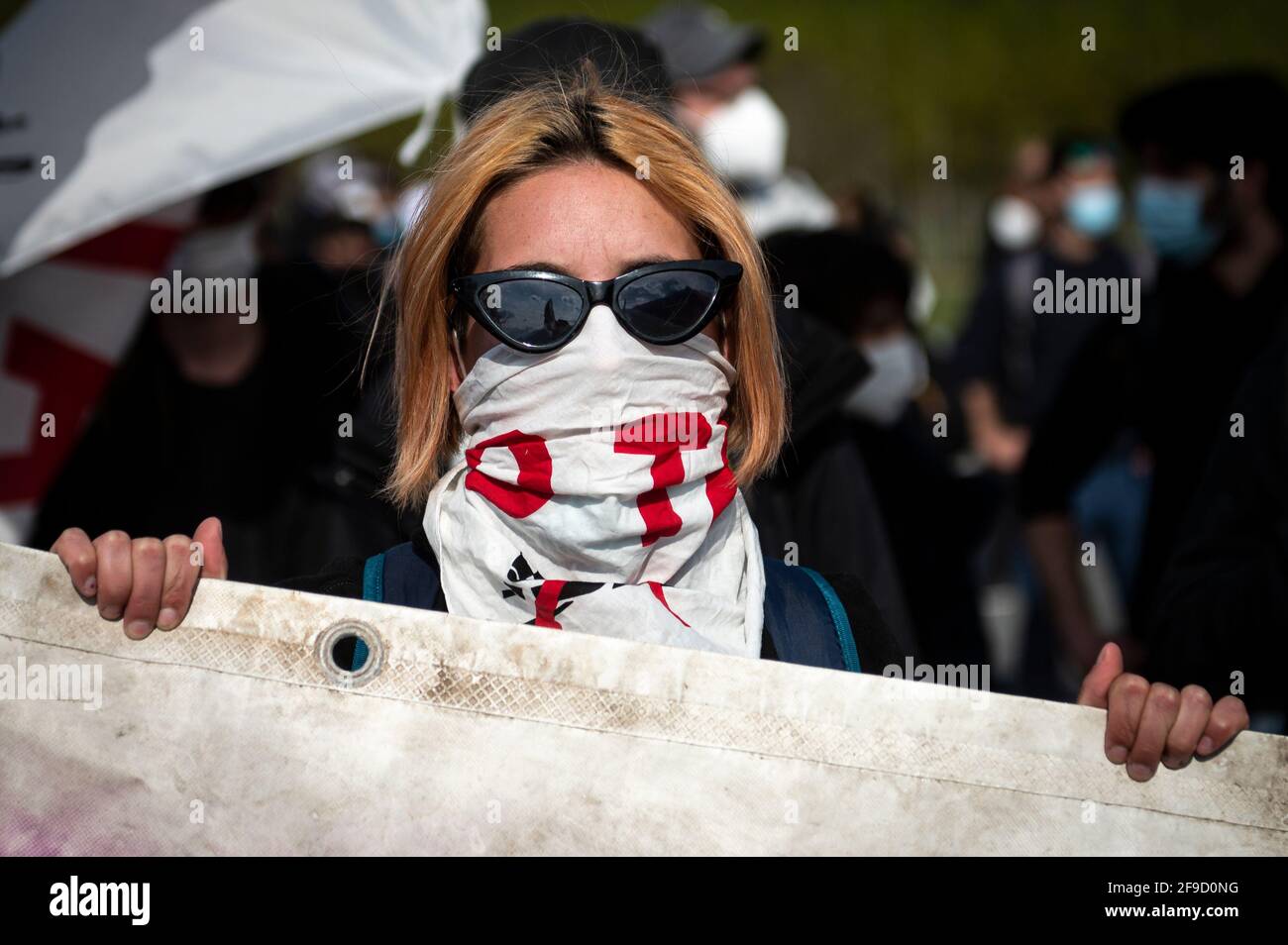 San Didero, Italy. 17 April 2021. A demonstrator looks on during a 'No TAV' (No to high-speed train) demonstration against Lyon-Turin high speed rail link. Credit: Nicolò Campo/Alamy Live News Stock Photo