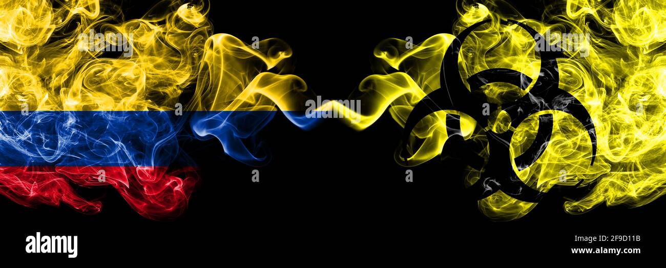 Colombia, Colombian vs Biohazard, Virus, Covid smoky mystic flags placed side by side. Thick colored silky abstract smokes flags. Stock Photo