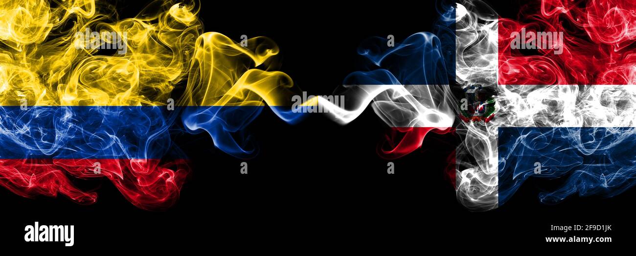 Colombia, Colombian vs Dominican Republic smoky mystic flags placed side by side. Thick colored silky abstract smokes flags. Stock Photo