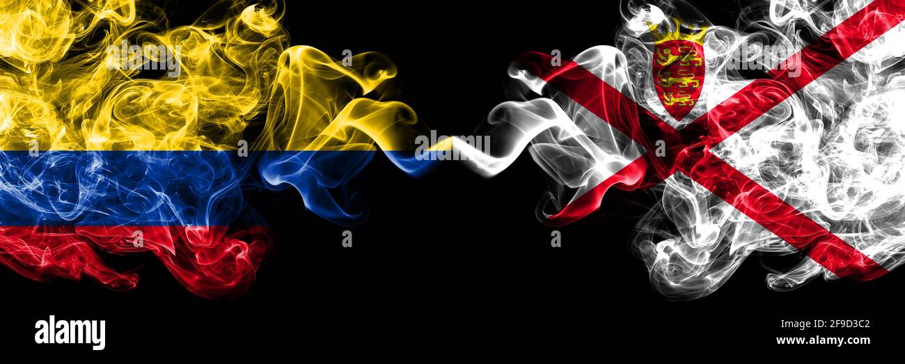 Colombia, Colombian vs United Kingdom, Great Britain, British, Jersey smoky mystic flags placed side by side. Thick colored silky abstract smokes flag Stock Photo