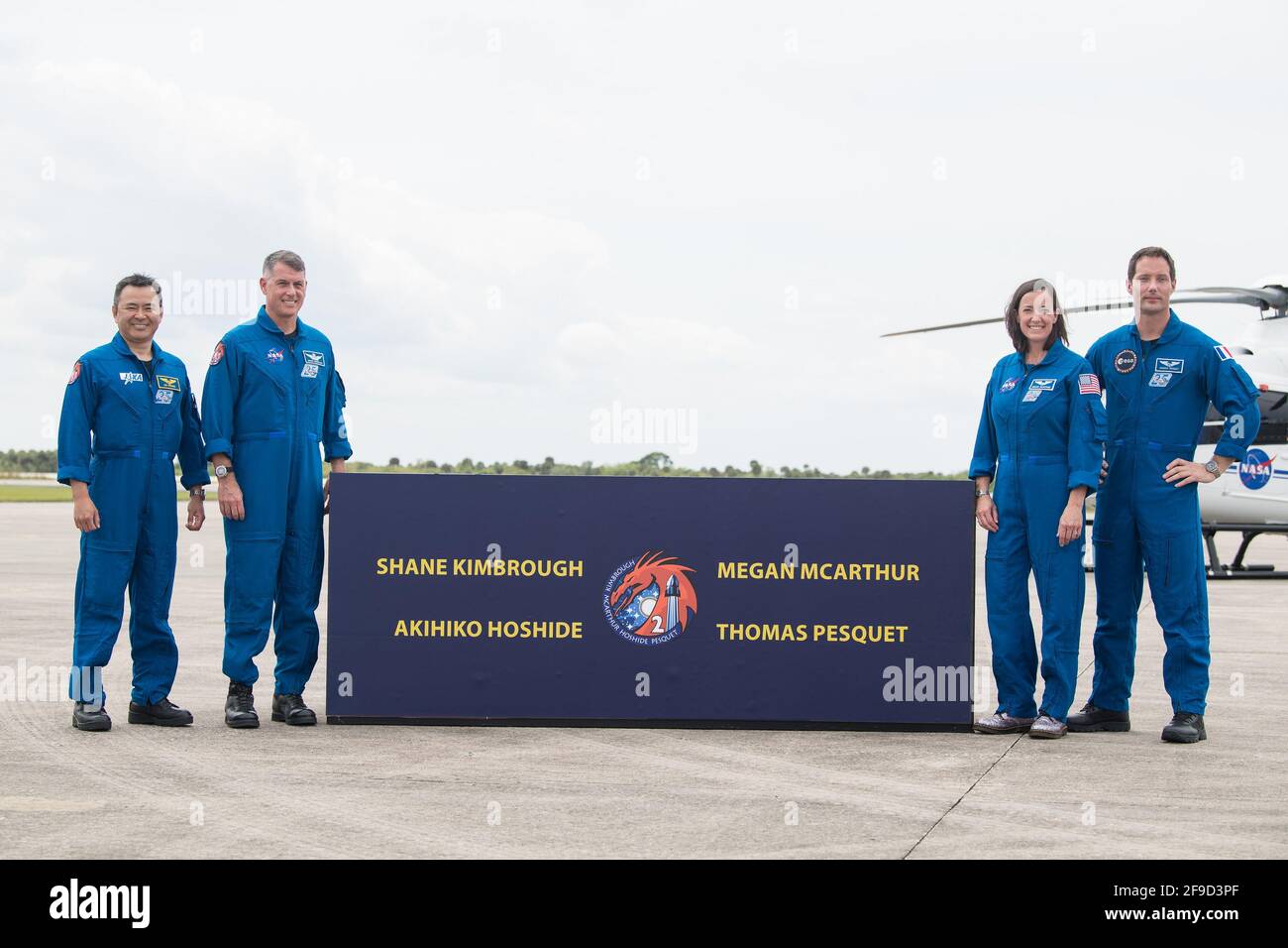 From left to right, Japan Aerospace Exploration Agency (JAXA) astronaut Akihiko Hoshide, NASA astronauts Shane Kimbrough and Megan McArthur, and ESA (European Space Agency) astronaut Thomas Pesquet pose for a photo after arriving at the Launch and Landing Facility at NASA's Kennedy Space Center ahead of SpaceX's Crew-2 mission, on Friday, April 16, 2021, in Florida. NASA's SpaceX Crew-2 mission is the second operational mission of the SpaceX Crew Dragon spacecraft and Falcon 9 rocket to the International Space Station as part of the agency's Commercial Crew Program. Kimbrough, McArthur, Pesque Stock Photo