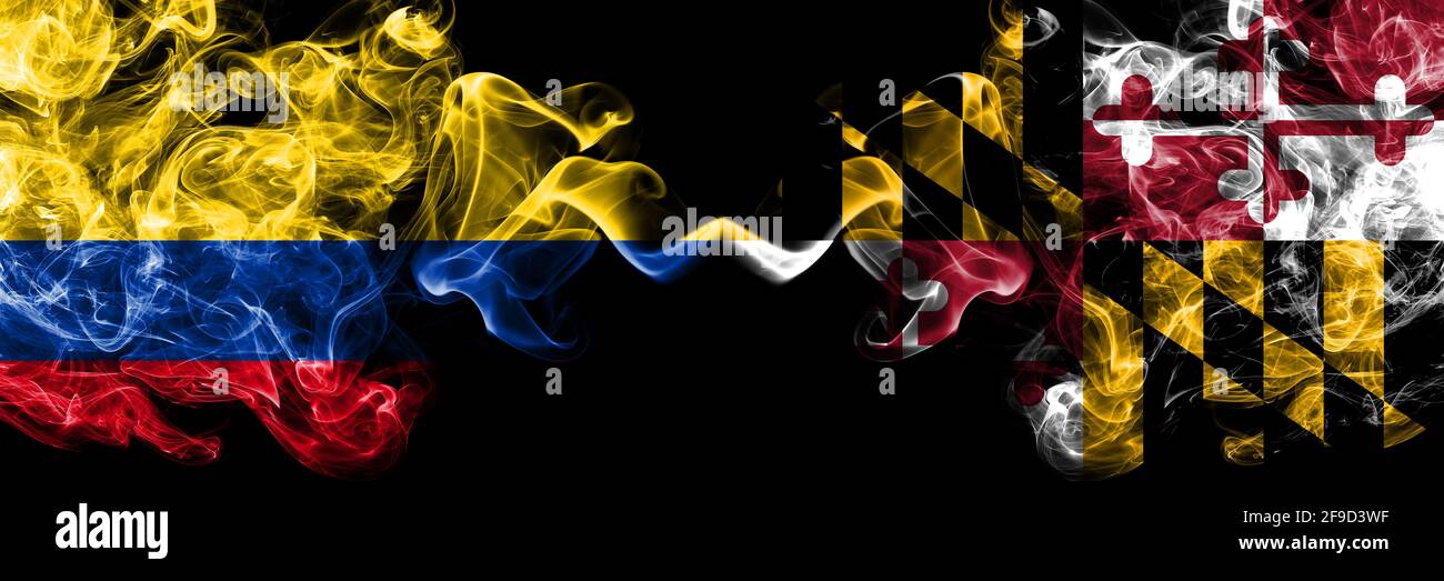 Colombia, Colombian vs United States of America, America, US, USA, American, Maryland smoky mystic flags placed side by side. Thick colored silky abst Stock Photo