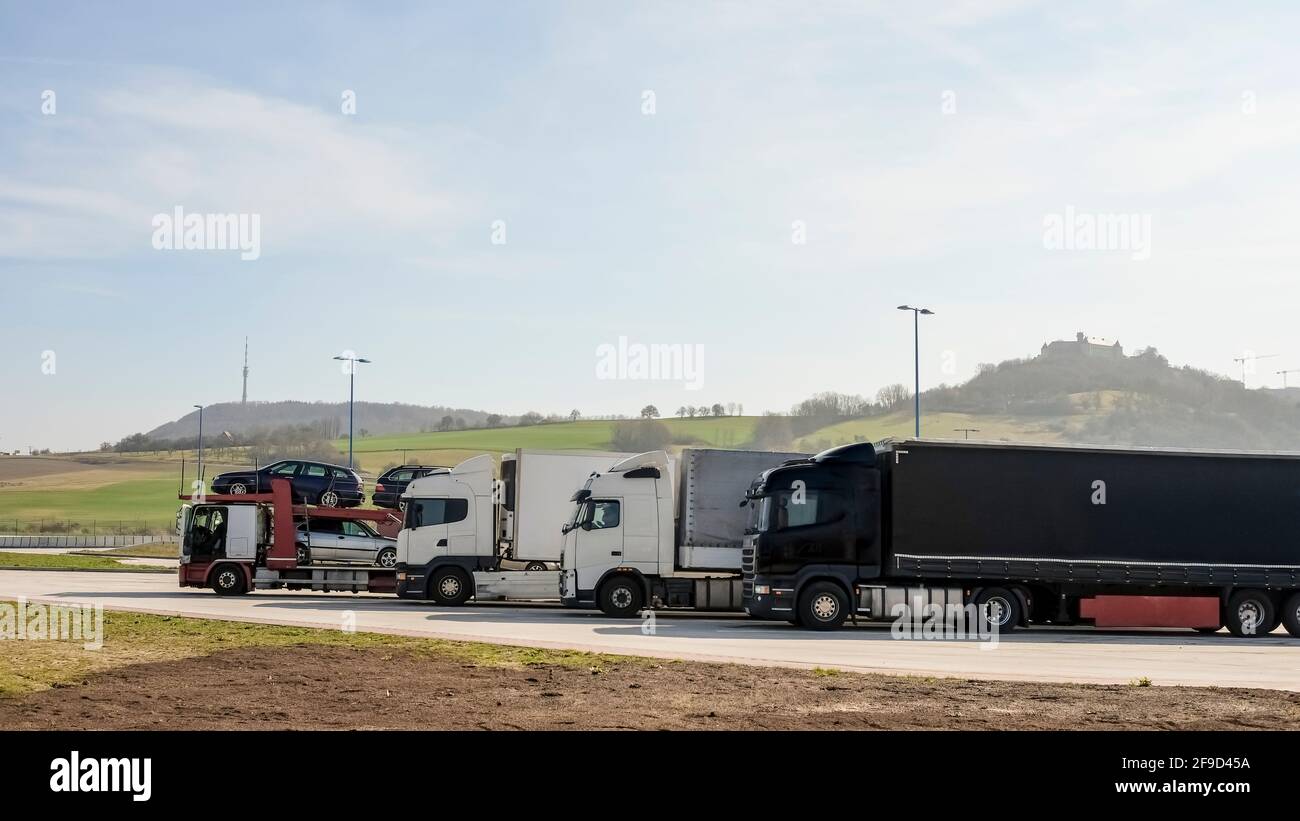 Group of supplies Tir camion on motorway parking,shipment goods transportation Stock Photo