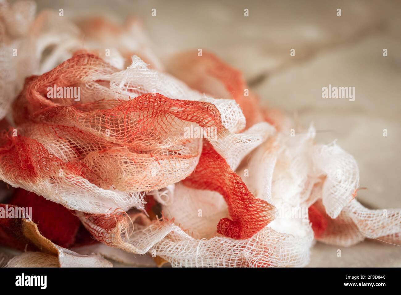 Bloody bandages on the table after a big wound or injuries, first