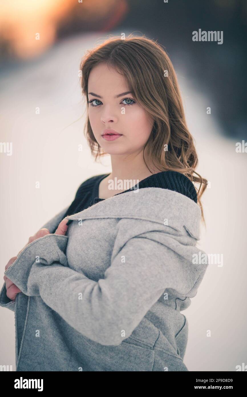 shallow-focus-of-a-brunette-woman-wearing-a-cardigan-with-a-sweater-and