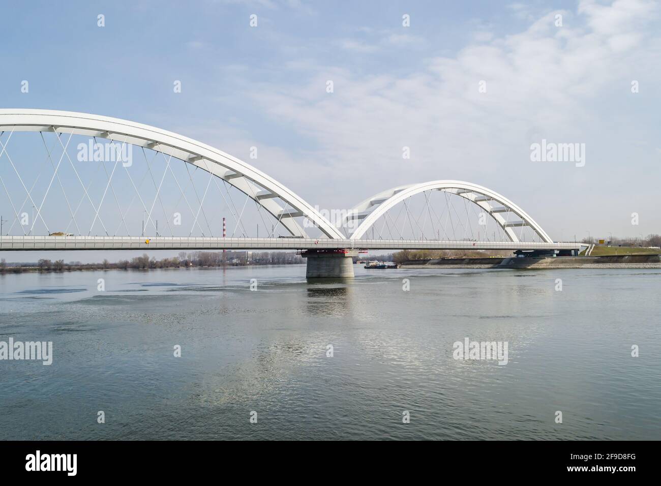 Novi Sad, Serbia - March 08. 2021: Zezelj bridge on river Danube in Novi Sad Serbia. The prospect of built New Zezelj Bridge viewed from the Petrovara. Stock Photo