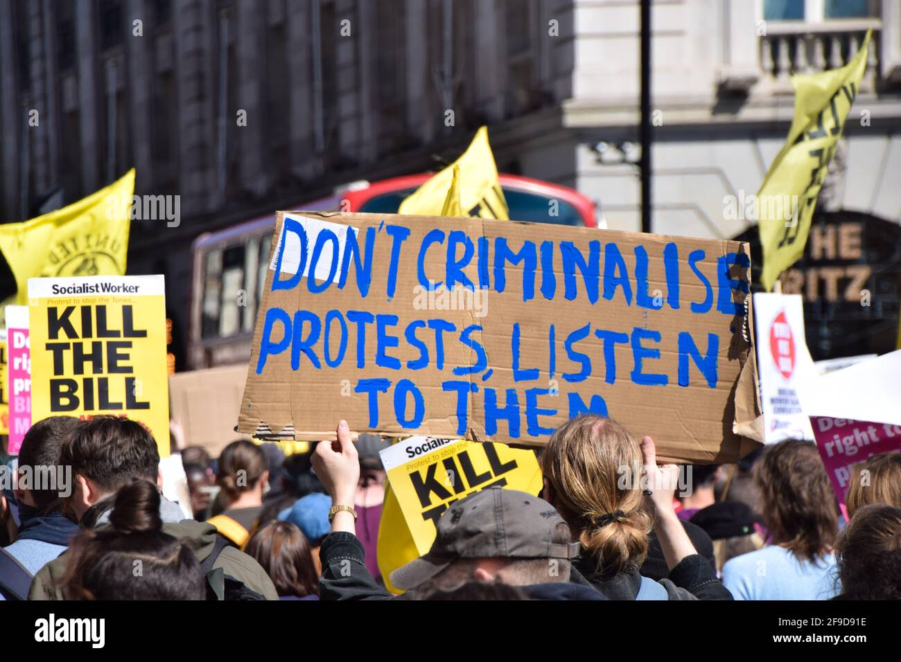 A protester holds a placard that says Don't Criminalise Protests, Listen To Them during the Kill The Bill protest in Central London.Crowds once again marched in protest against the Police, Crime, Sentencing and Courts Bill. Stock Photo