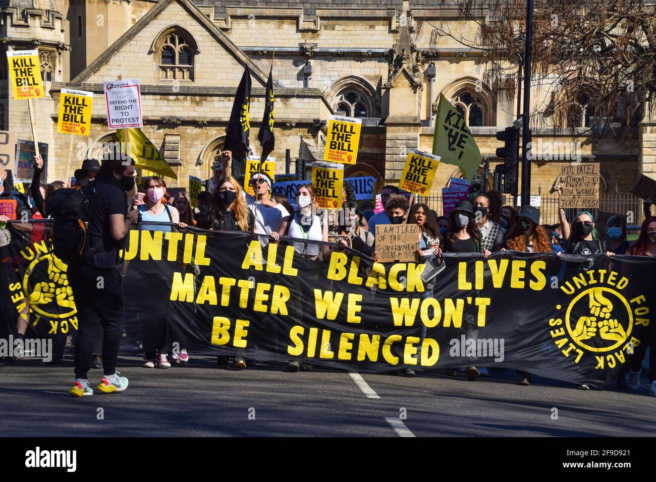 Protesters hold a Black Lives Matter banner and placards during the Kill The Bill demonstration in Parliament Square.Crowds once again marched in protest against the Police, Crime, Sentencing and Courts Bill. Stock Photo
