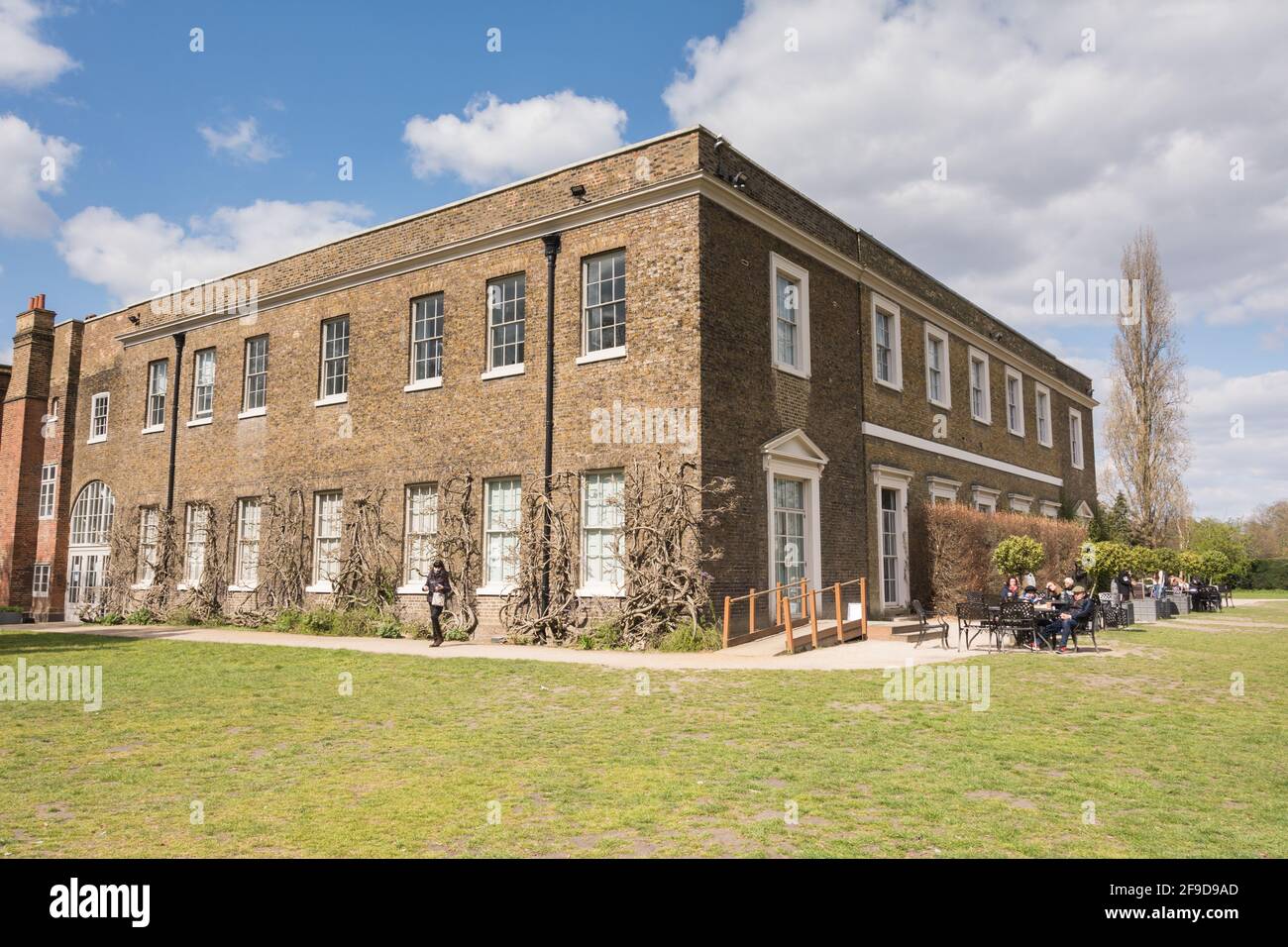 People eating al fresco at Fulham Palace, the historic house and gardens of the Bishop of London on Bishop's Avenue, Fulham, London, England, U.K. Stock Photo