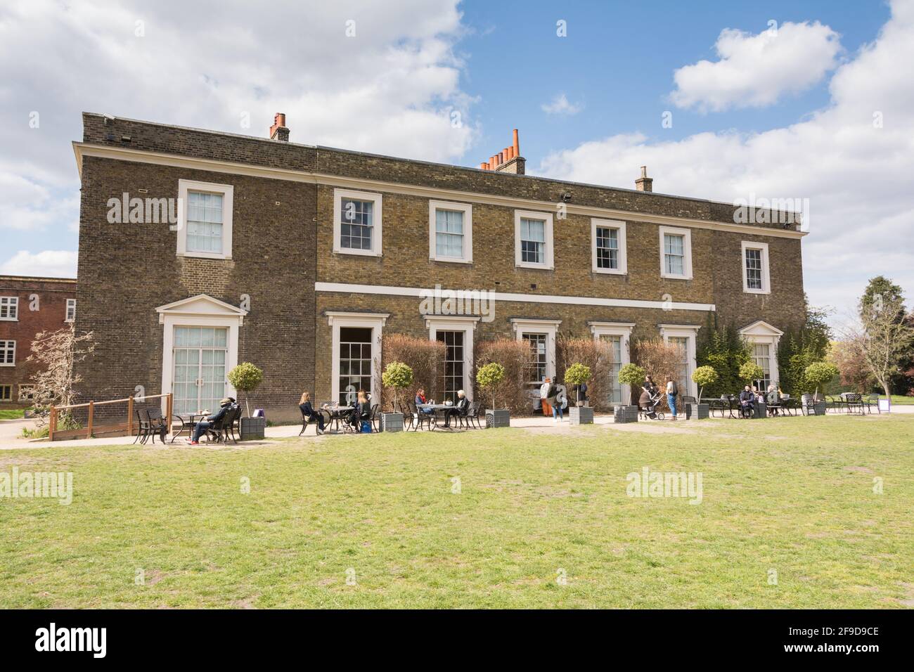 People eating al fresco at Fulham Palace, the historic house and gardens of the Bishop of London on Bishop's Avenue, Fulham, London, England, U.K. Stock Photo