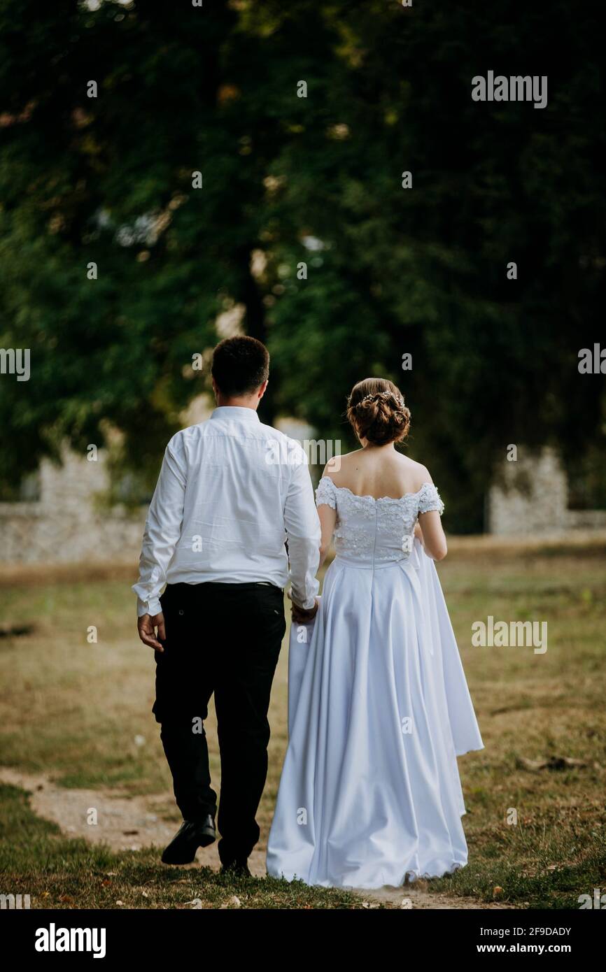 Woman long dress rear view park hi-res stock photography and images - Alamy