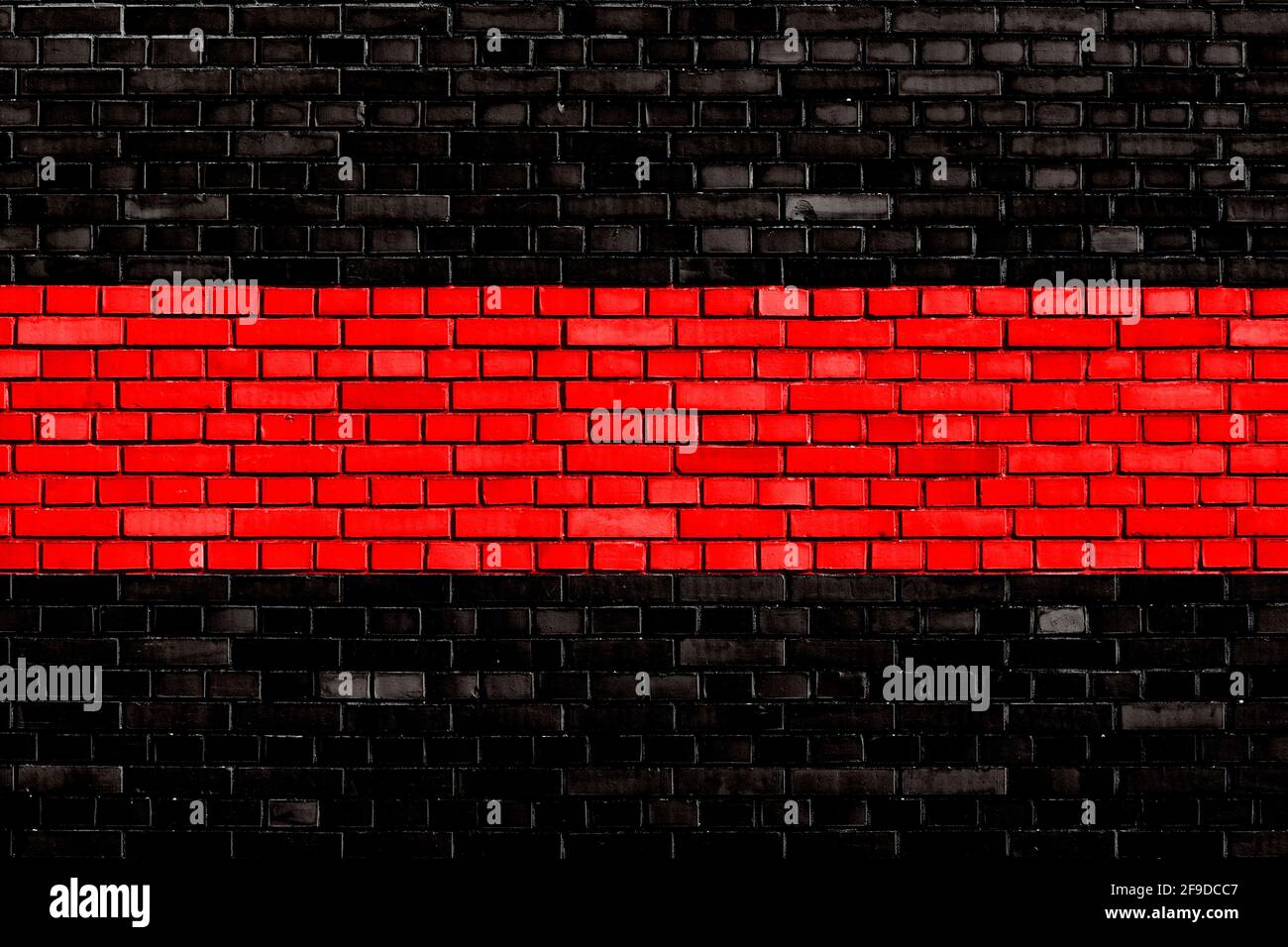 black red colored brick wall background Stock Photo