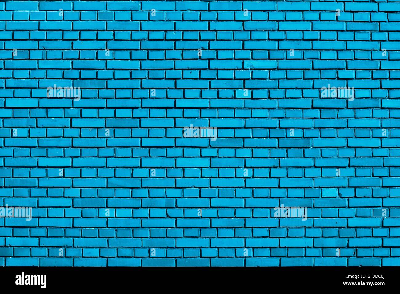 light blue colored brick wall background Stock Photo