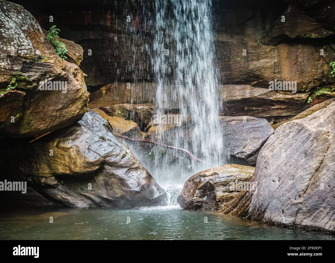 Waterfall near body of Water Stock Photo