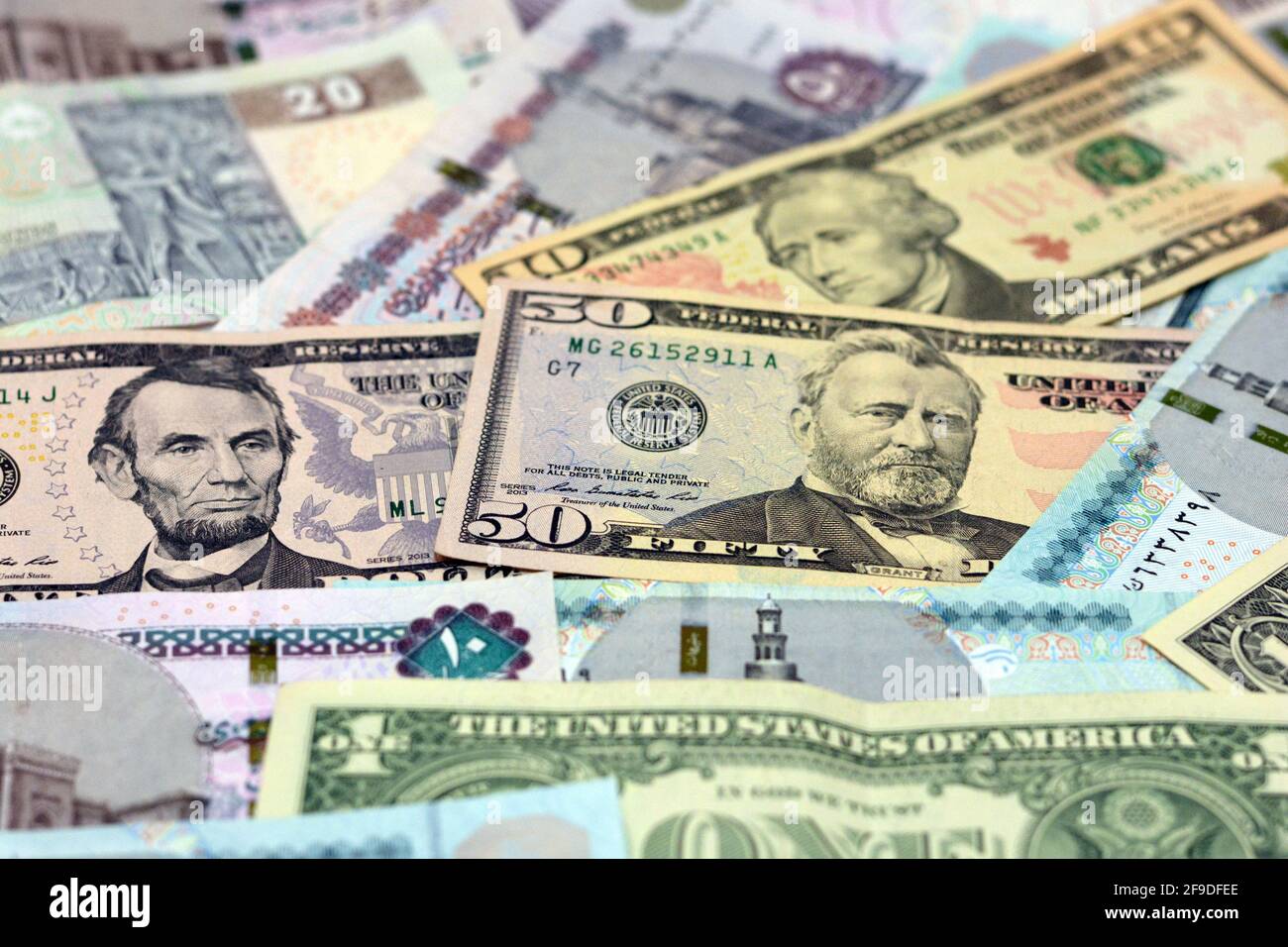 Egypt national currency with USA dollar banknote backdrop. Money