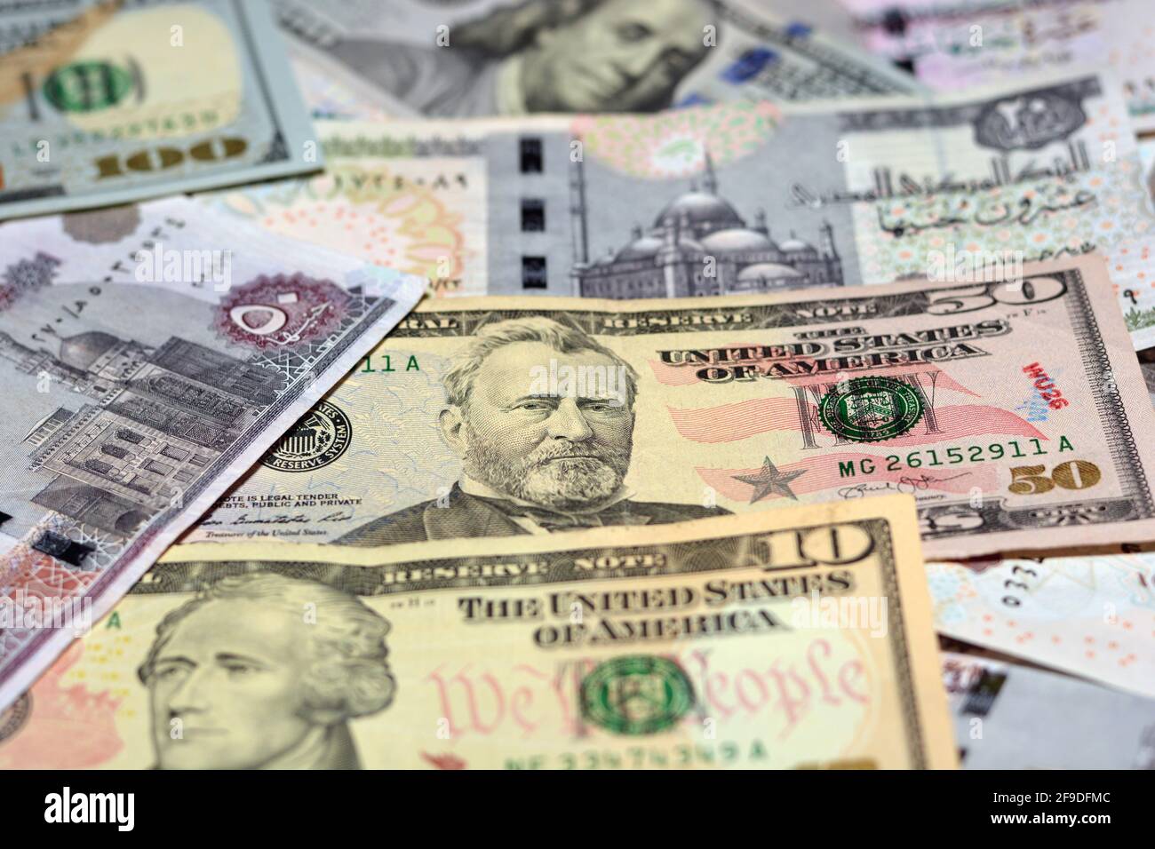 Egypt national currency with USA dollar banknote backdrop. Money