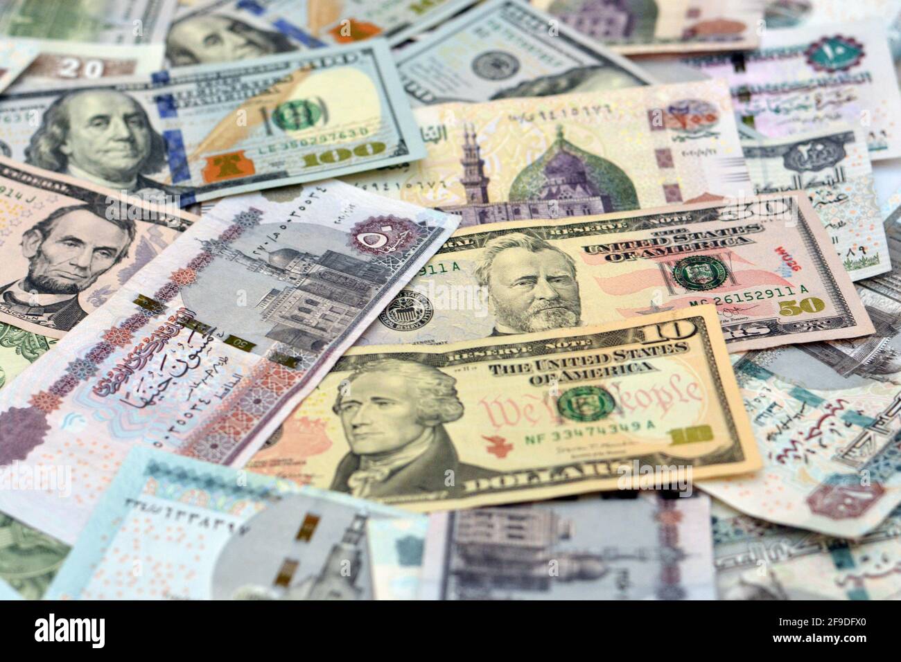 Egypt national currency with USA dollar banknote backdrop. Money