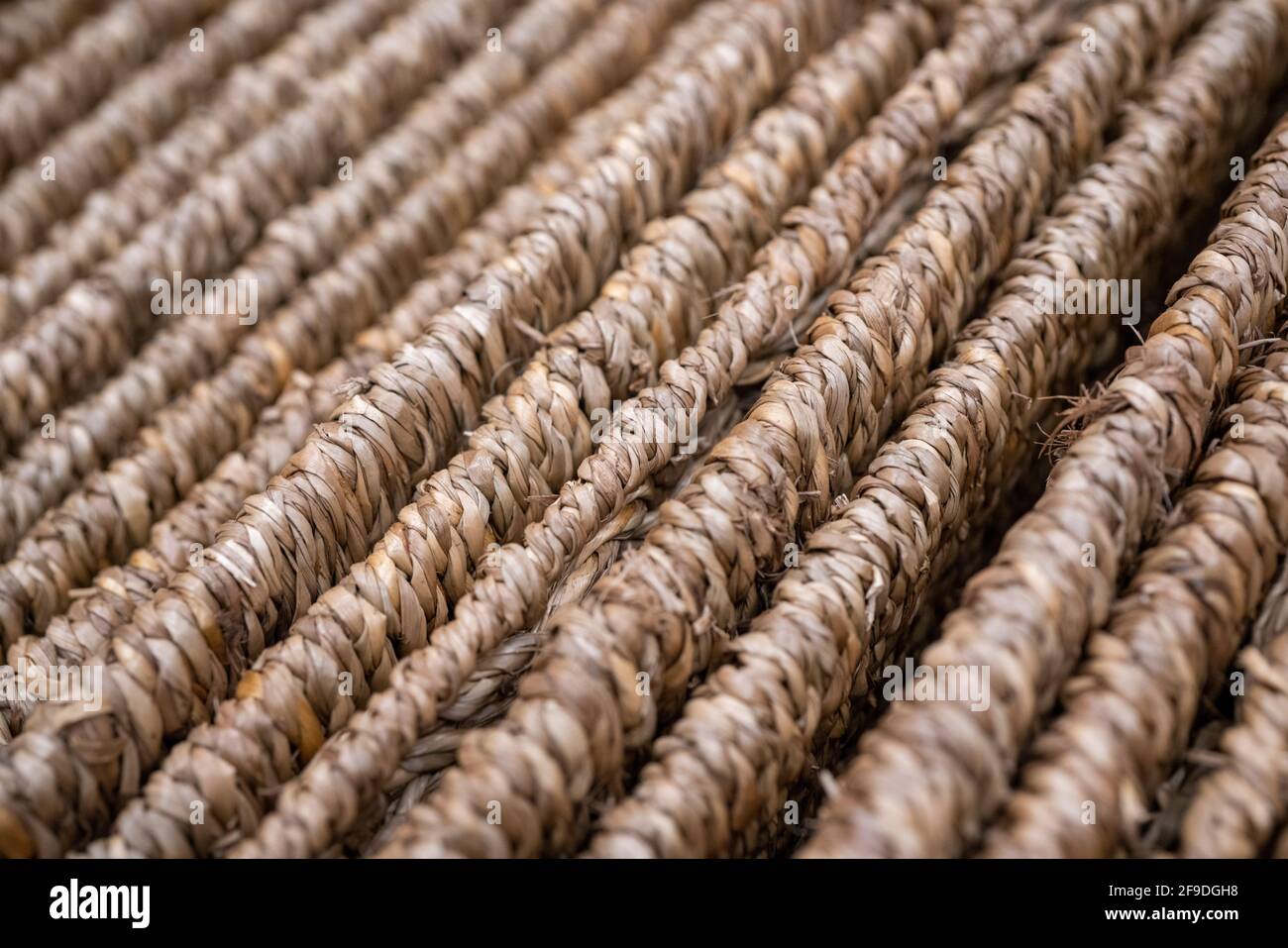 Surface of woven straw mat, use as background. Stock Photo