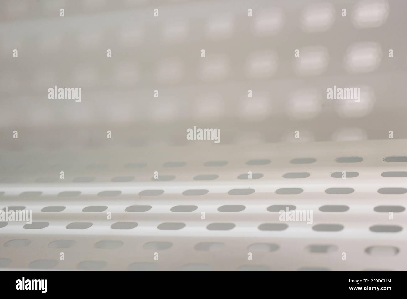 Light penetrates through the holes, use as background. Stock Photo