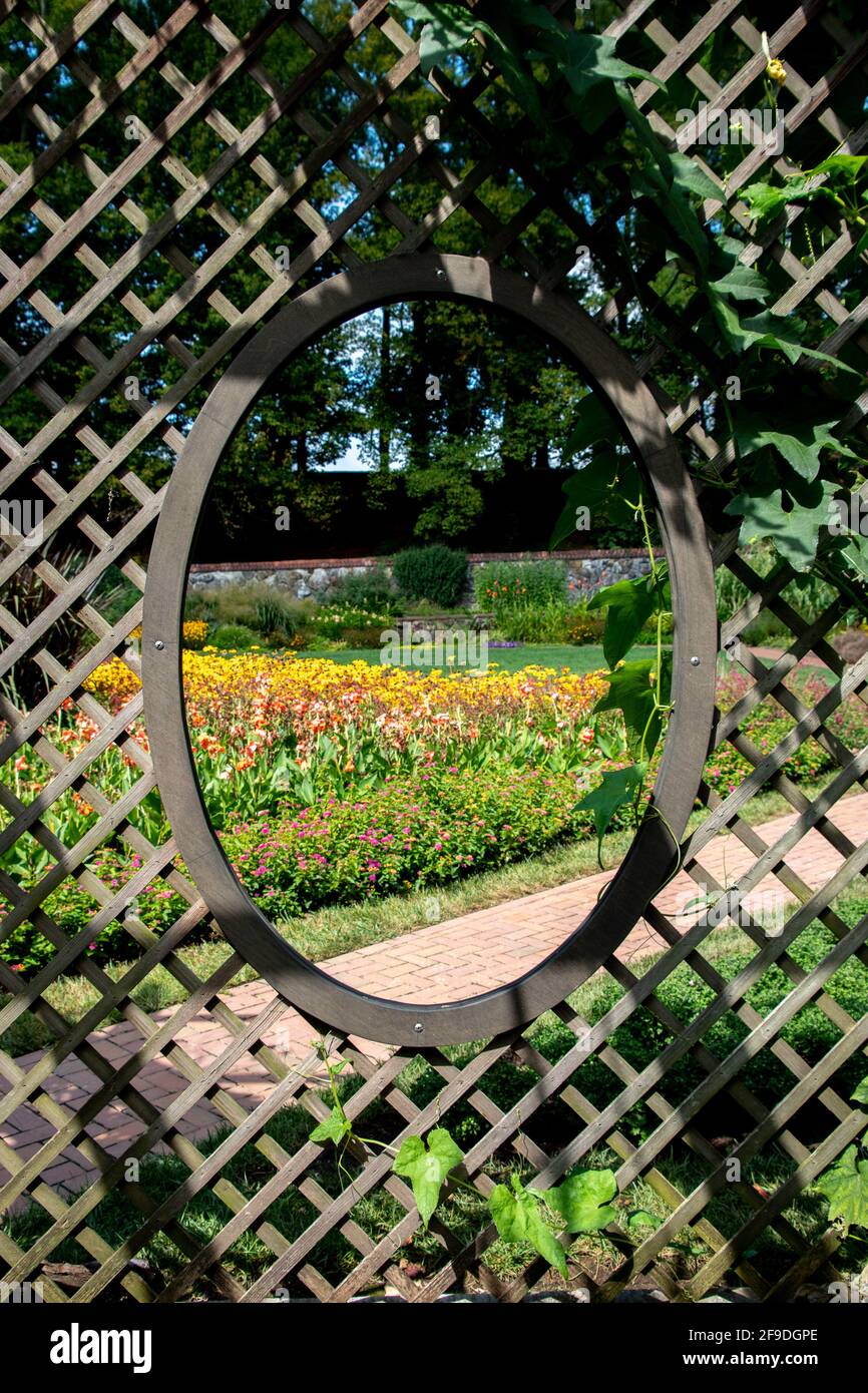 Framing a garden with a wooden lattice Stock Photo