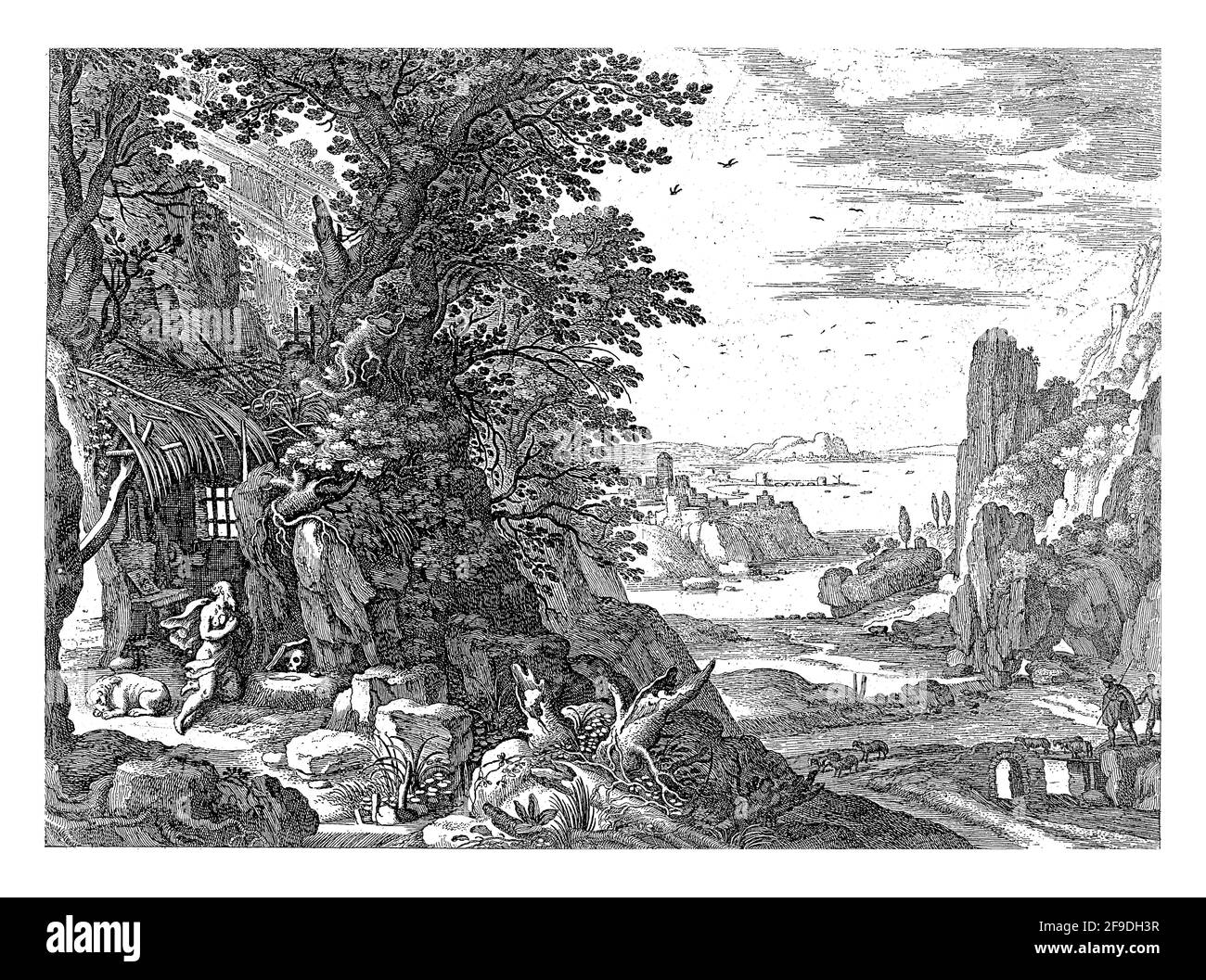 Saint Jerome kneels in his hut. In front of him are a skull and a book and next to him is the lion. An Italian river landscape stretches to the right. Stock Photo