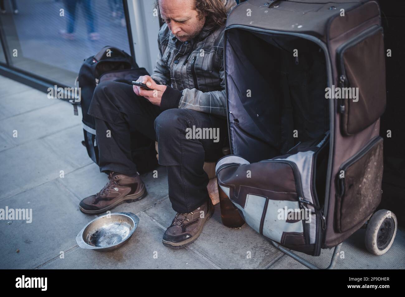 Soho, London | UK - 2021.04.16: Homeless man sitting on the pavement ...