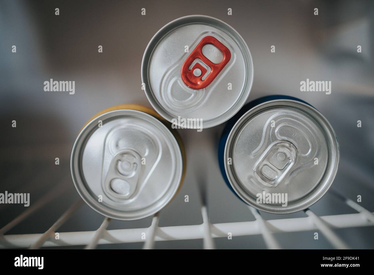 A top view of drink cans put in the refrigerator to keep them cold
