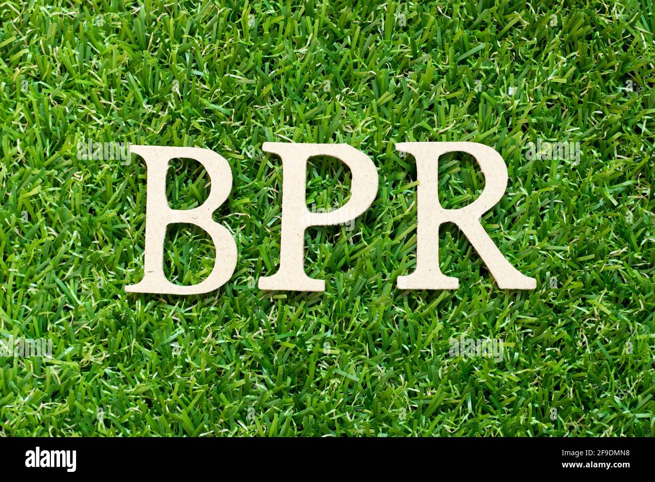 Alphabet letter in word BPR (Abbreviation of Business Process Reengineering or Batch processing record) on green grass background Stock Photo