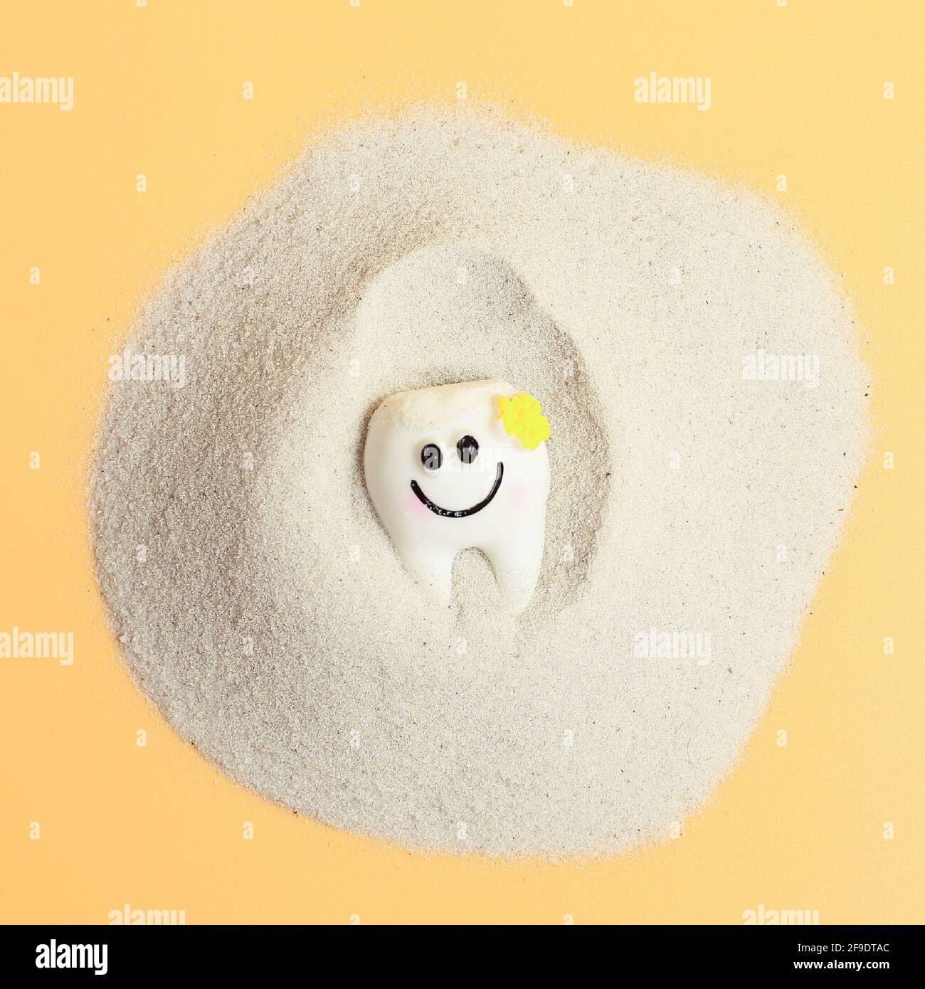 Smile of a tooth in the sand, healthcare, love, family dentist, world